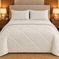 Ivory Embossed Sukoon Cotton Bed in a Bag by Reet (bed in a bag, comforter set with king bedsheet) — comforter on the bed