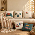 Chidiya Folk Art Linen Blend Cushion Covers, Set of 5 by Reet (printed linen blend cushion covers 16x16 in, set of 5) — lifestyle: the set of 5 on a sofa