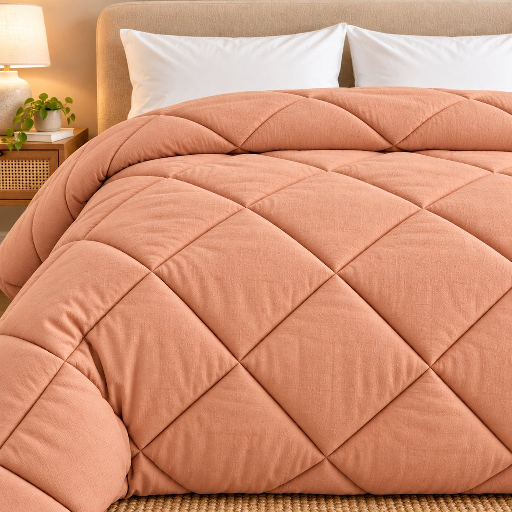 Peach Shir-o-Shakar Seersucker Comforter by Reet (peach seersucker AC comforter, light orange / pink, double bed 90x100) — front view, closer